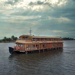 A Deluxe houseboat in Alleppey with traditional architecture and modern amenities.