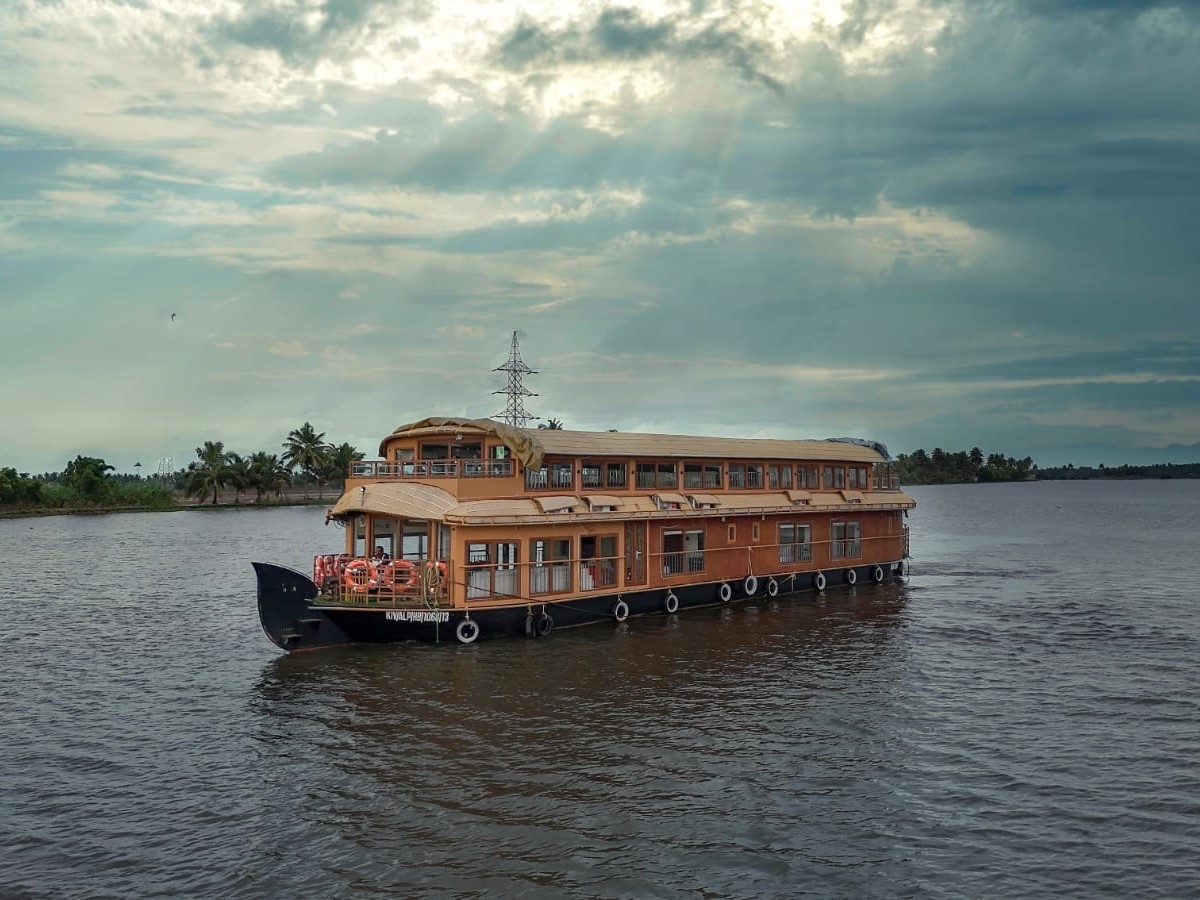 A Deluxe houseboat in Alleppey with traditional architecture and modern amenities.