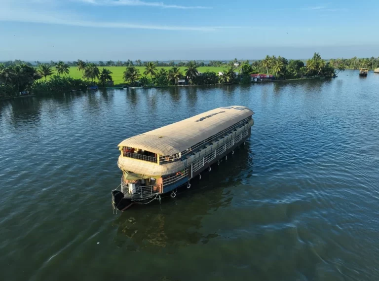 A Premium Alleppey houseboat cruising through Vembanad Lake - Kerala Backwaters