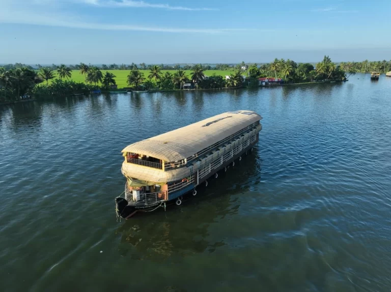 A Premium Alleppey houseboat cruising through Vembanad Lake - Kerala Backwaters